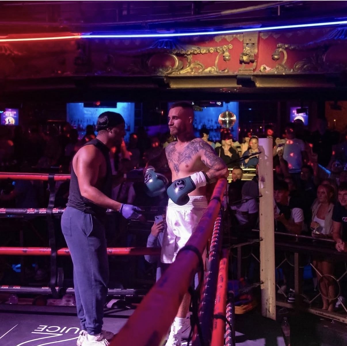 Coach Leonardo cornering a fighter in the ring